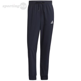 Spodnie męskie adidas Essentials Tapered Cuff 3 Stripes Pants granatowe GK8981 Adidas