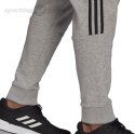 Spodnie męskie adidas Essentials Tapered Cuff 3 Stripes szare GK8976 Adidas