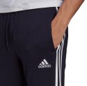 Spodnie męskie adidas Essentials Fleece Tapered Cuff 3-Band Pants granatowe GK8823 Adidas