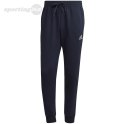 Spodnie męskie adidas Essentials Fleece Regular Tapered granatowe HL2231 Adidas