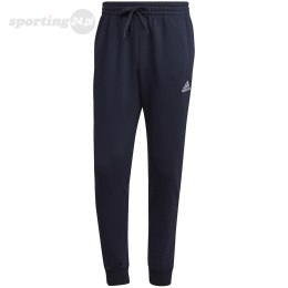 Spodnie męskie adidas Essentials Fleece Regular Tapered granatowe HL2231 Adidas