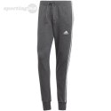 Spodnie męskie adidas Essentials French Terry Tapered Cuff 3-Stripes szare IC9408 Adidas